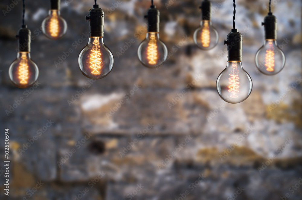 Idea and teamwork concept Vintage  bulbs on wall background