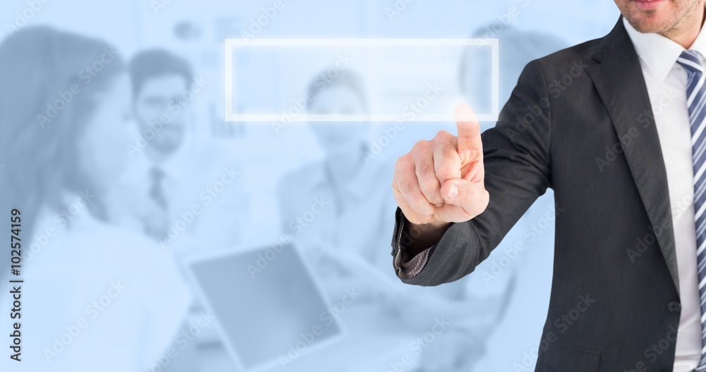 Composite image of businessman pointing with his finger