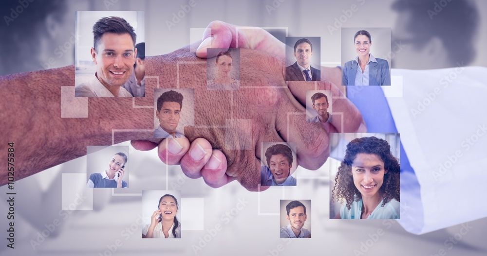 Composite image of business people shaking hands