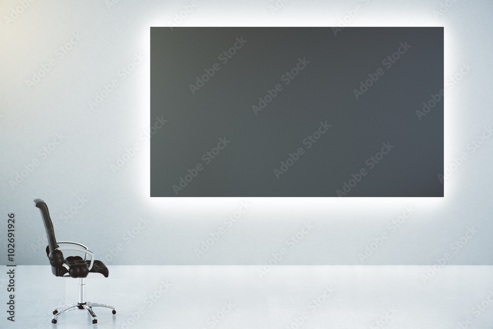 Blank black poster on white wall and classic leather chair, mock