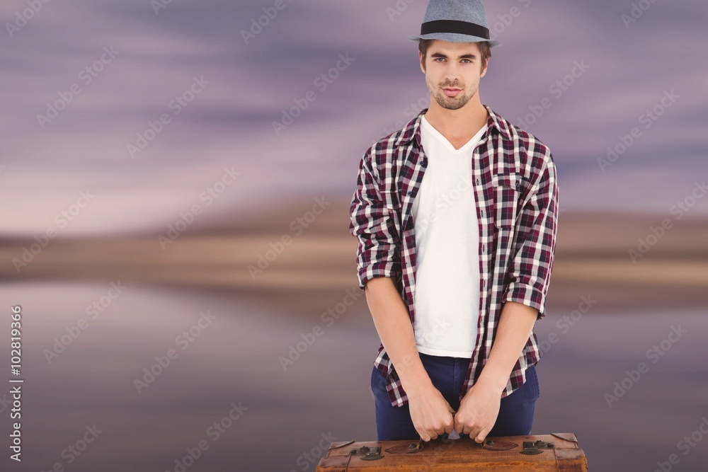 Composite image of confident man holding briefcase