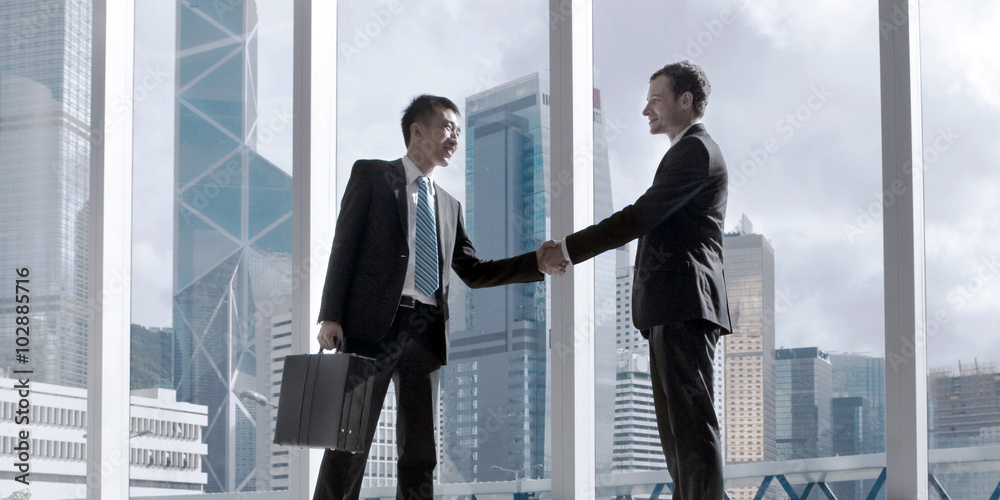 Asian Business Handshake Agreement Partnetship Concept