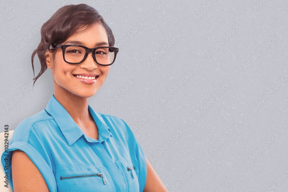 Composite image of portrait of smiling businesswoman 