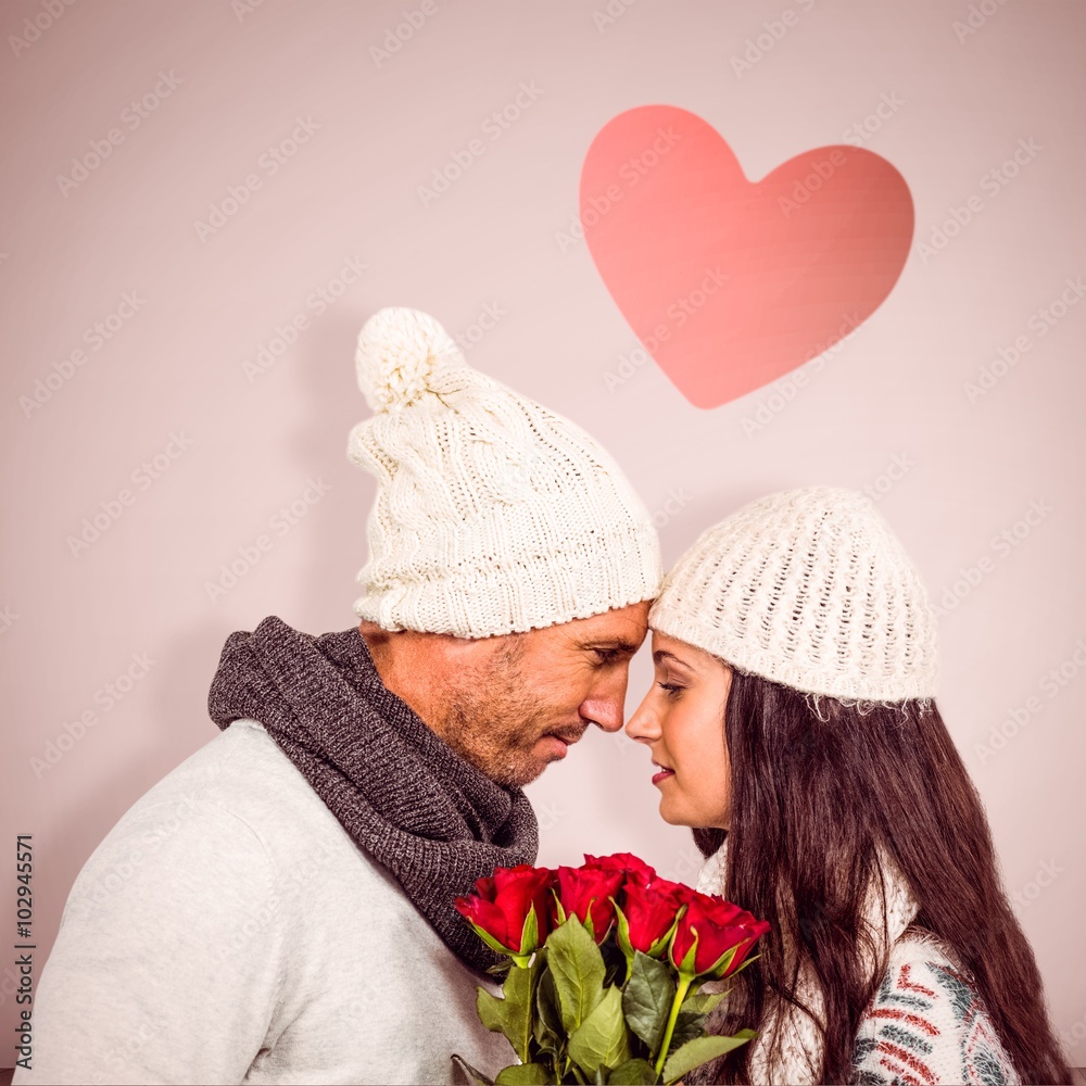 Composite image of couple nose-to-nose holding roses bouquet