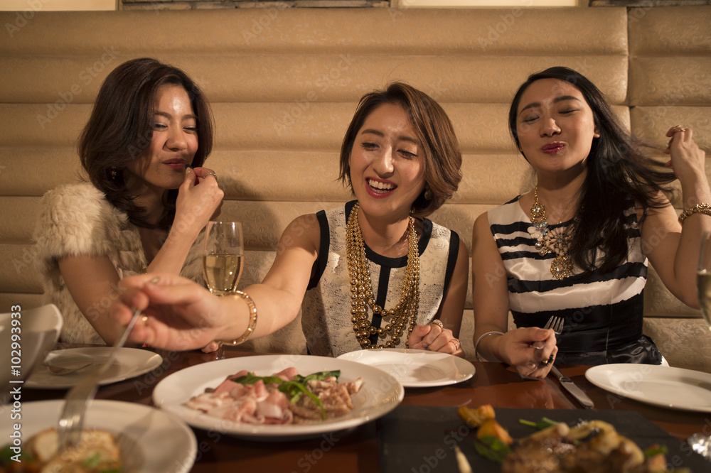 Women laughing while dining in the restaurant