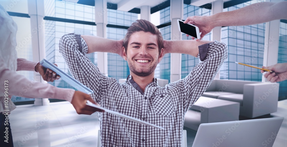 Composite image of smiling businessman being handed items