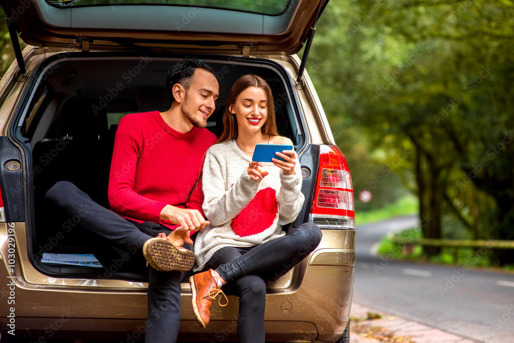 Couple traveling by car