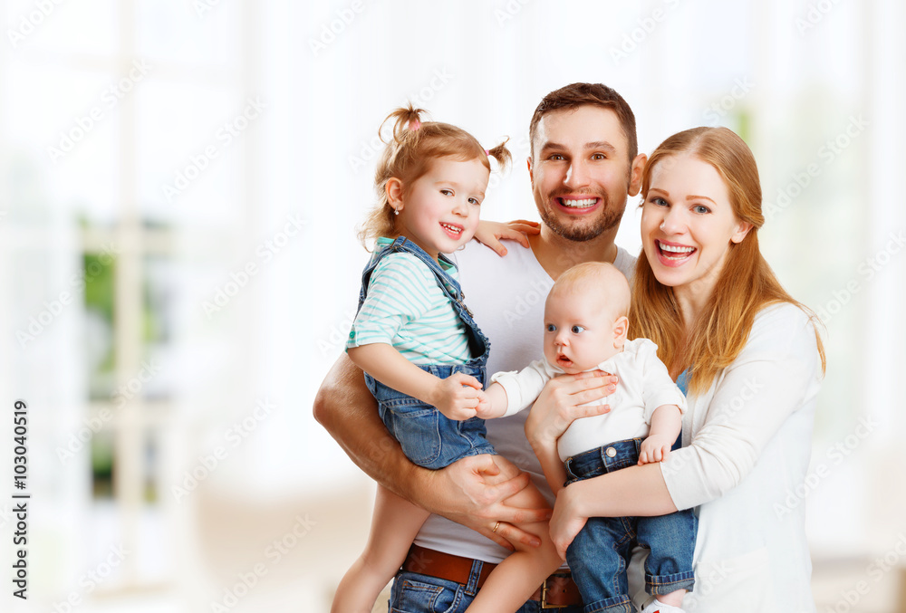 happy family mother, father and children at home