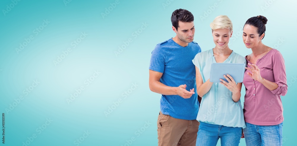 Composite image of happy colleagues using tablet