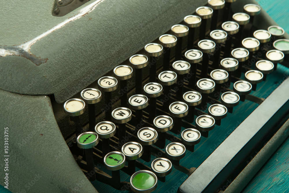 typewriter on the blue wooden desk