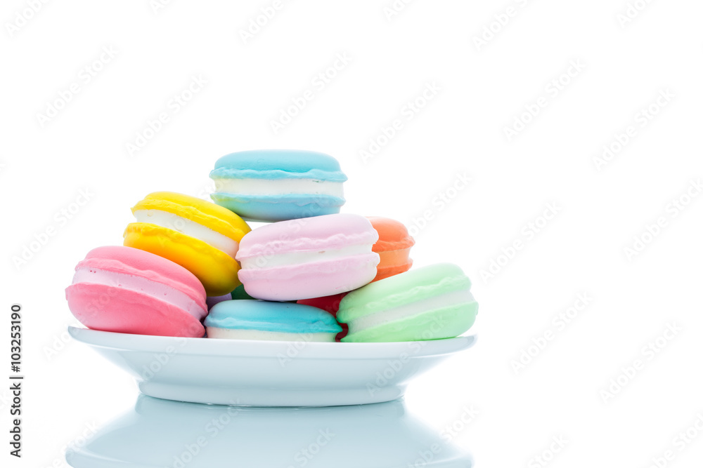 French colorful macarons stacks in dish