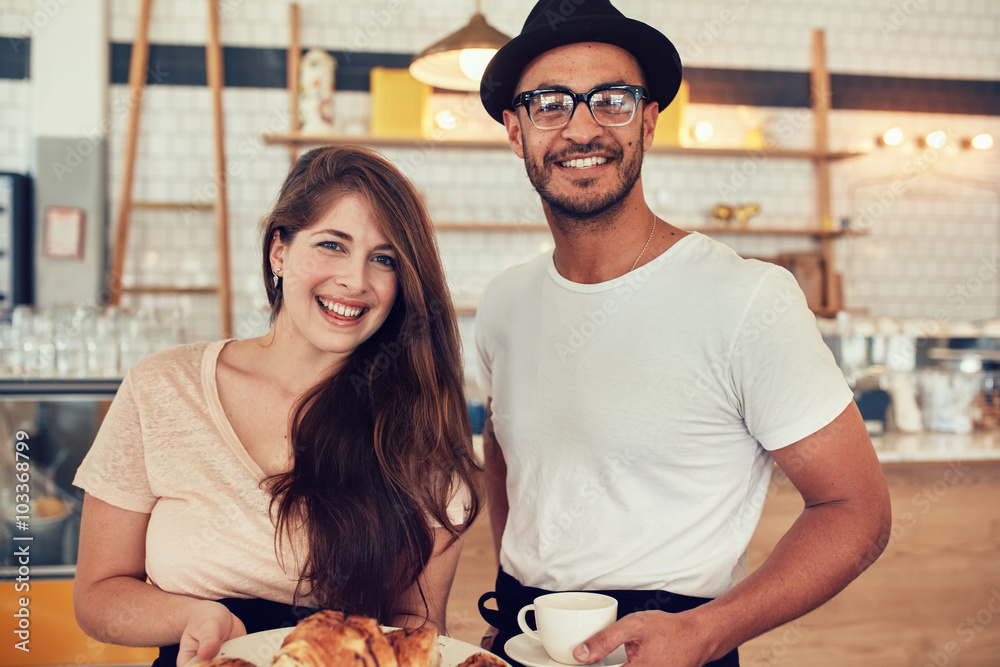 Couple with food and drink at coffee shop