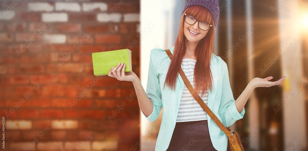 Composite image of smiling hipster woman with bag and book