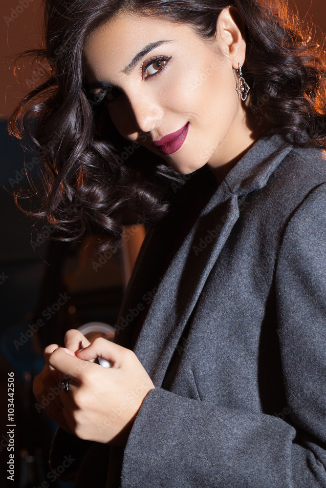 beautiful woman with earring and black hair