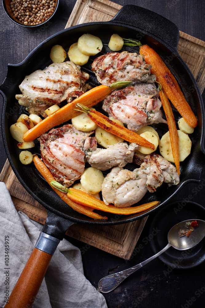 chicken meat and roasted vegetables on cooking pan