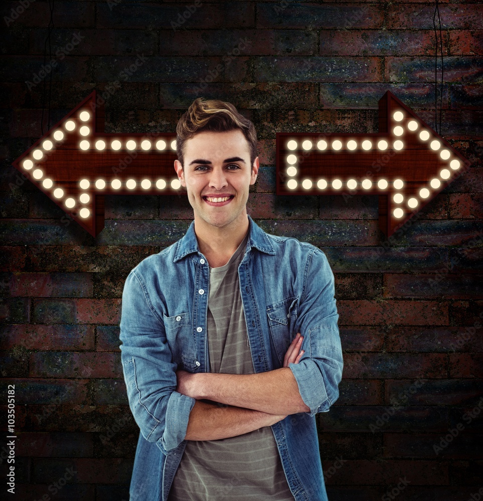 Composite image of smiling creative businessman by his desk