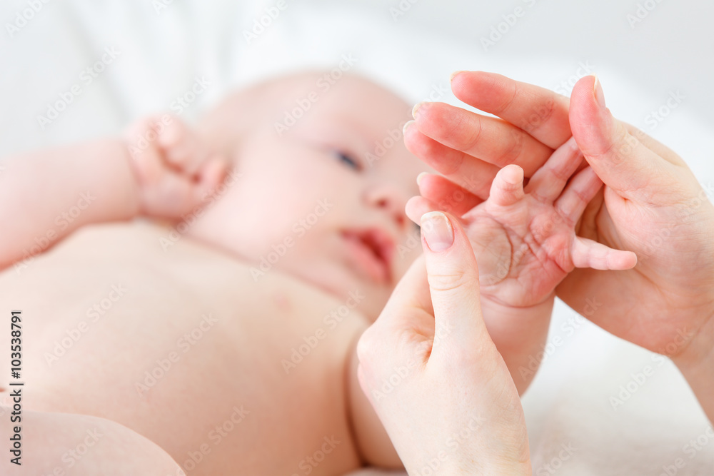 concept of parental love. baby hand holding  finger of mother