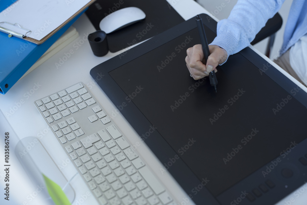 Women are using a graphics tablet