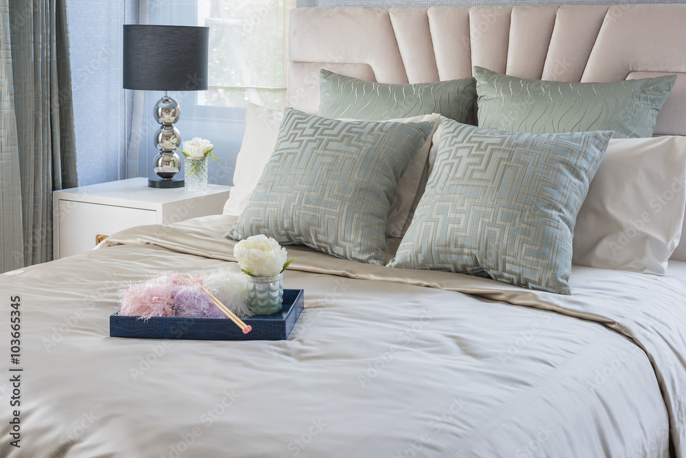 vase of flower on blue tray in luxury bedroom