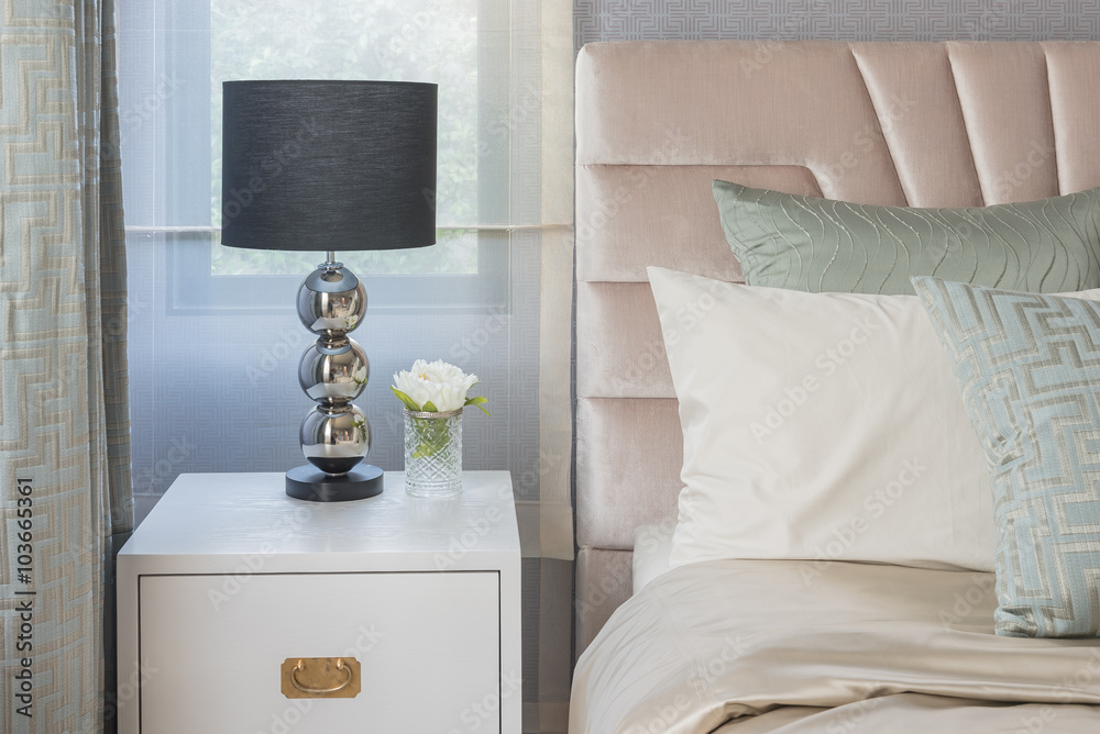 black lamp on white wooden table side in bedroom