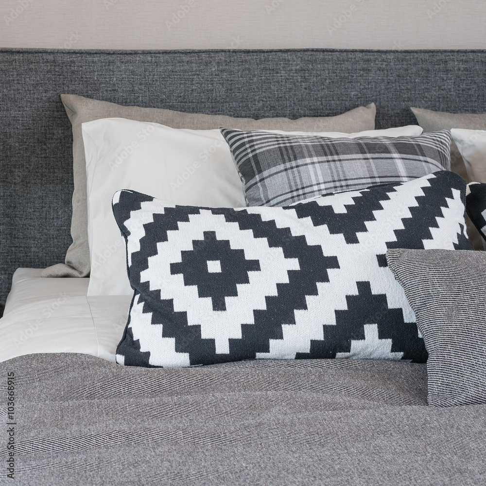 black and white pillows on modern bed