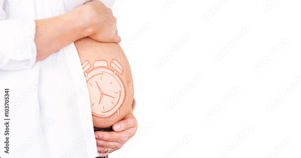 Composite image of midsection of pregnant woman holding belly