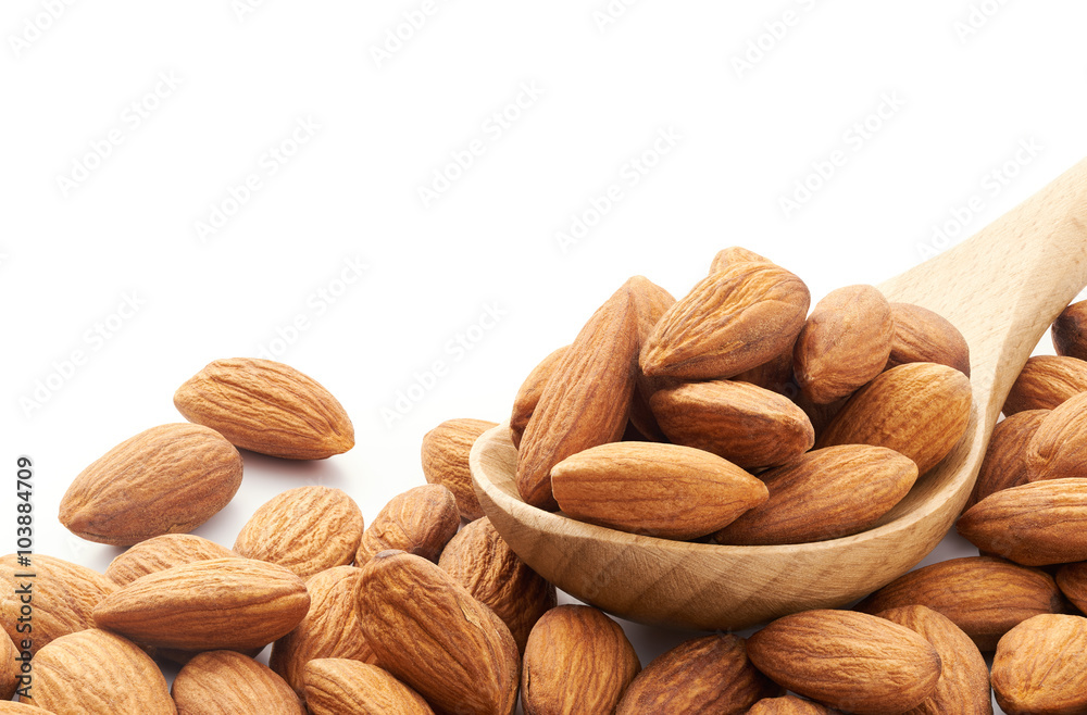 Almonds on wooden spoon