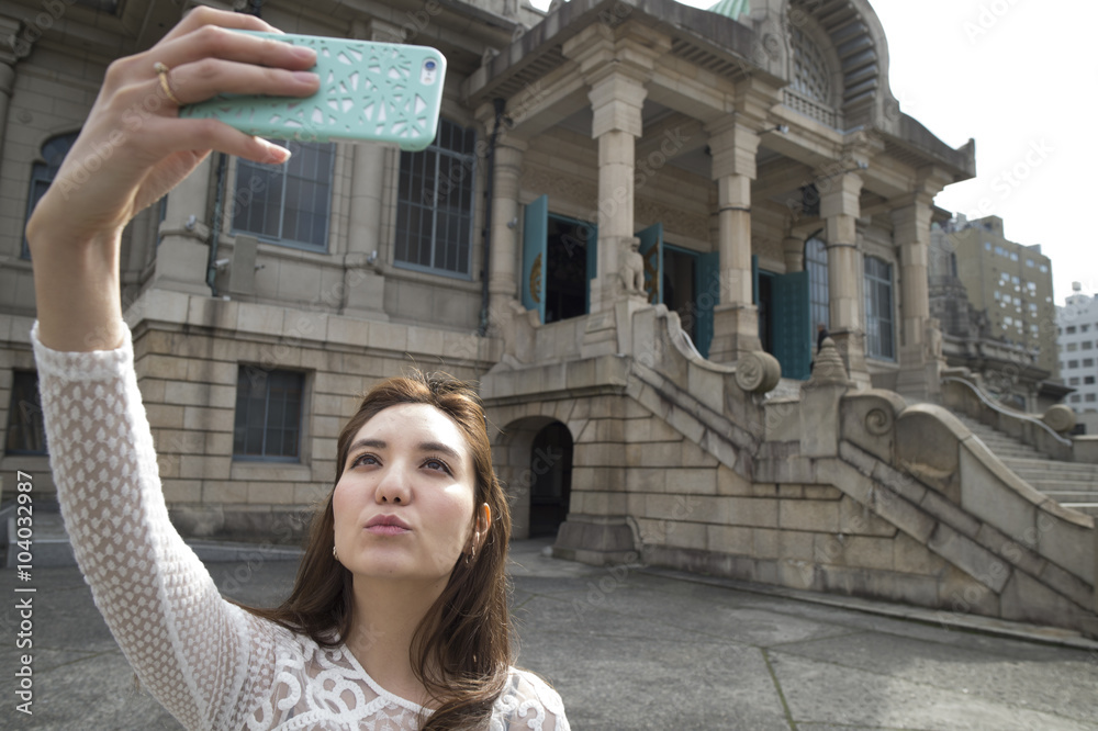 Young women are self shot at the tourist destination