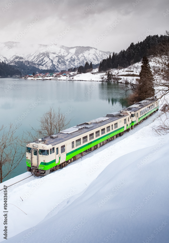 Japan mountain and snow with local train in winter season at Mishima town , Fukushima prefecture