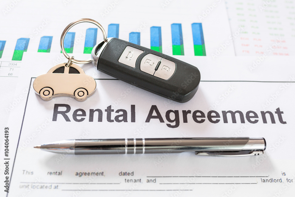 Signing car rental agreement contract