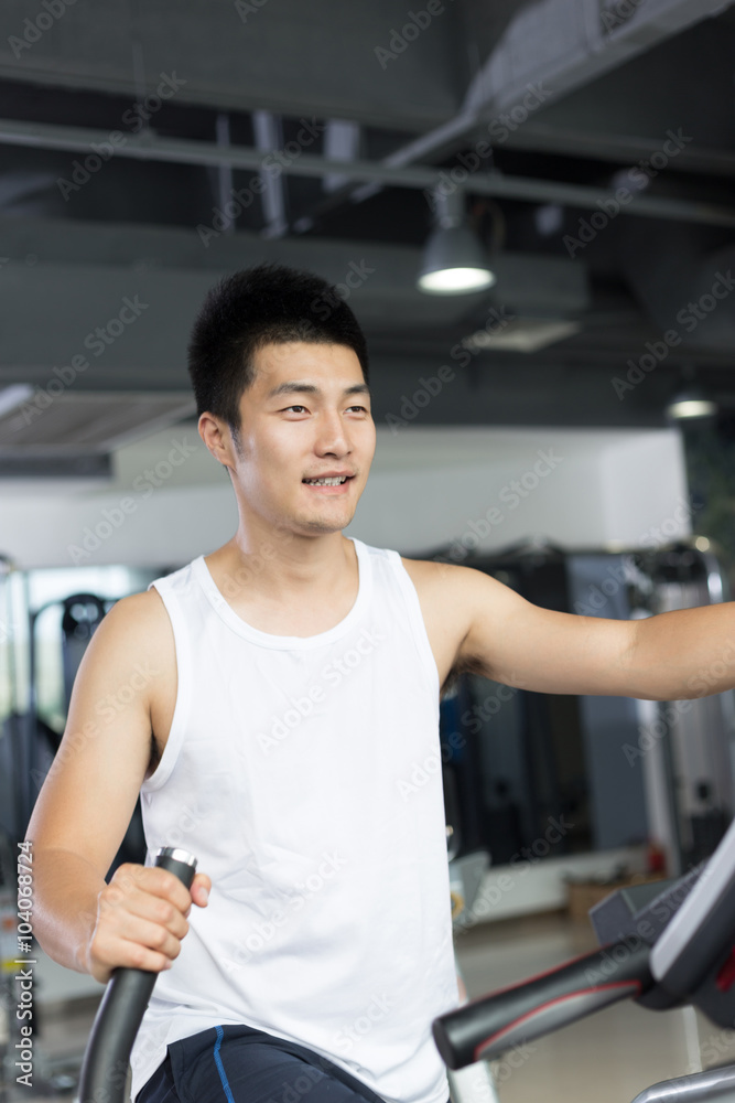 young man working out in modern gym