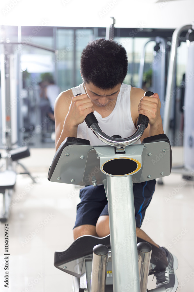 young man working out in modern gym