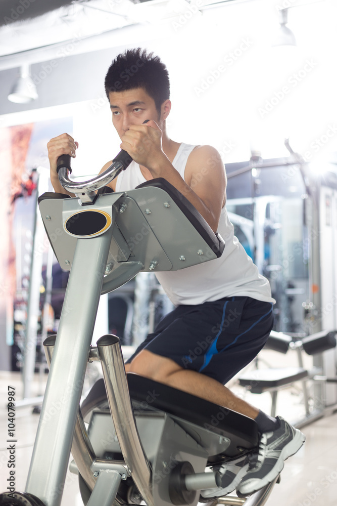 young man working out in modern gym