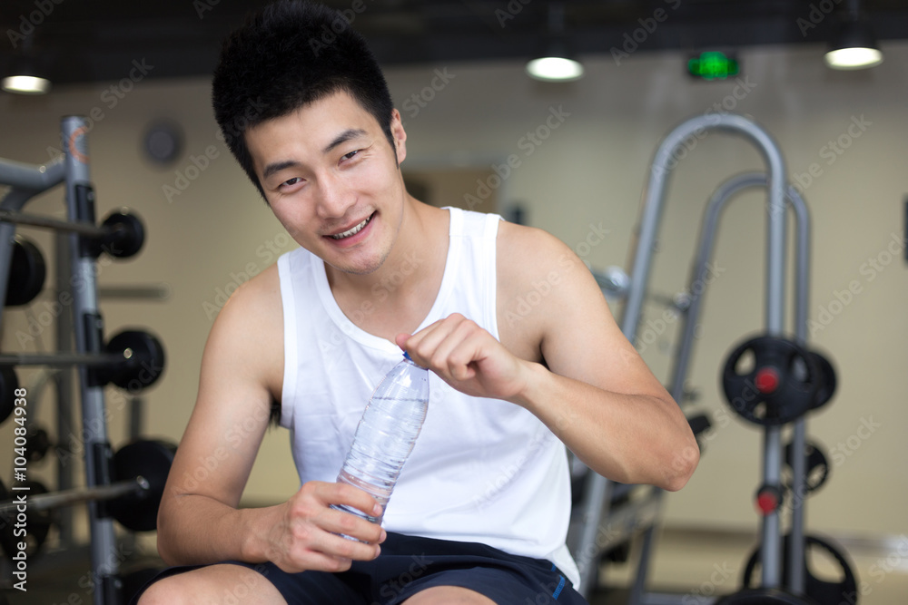 young man working out in modern gym