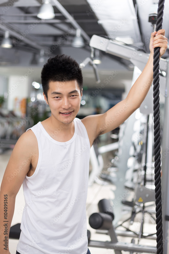 young man working out in modern gym