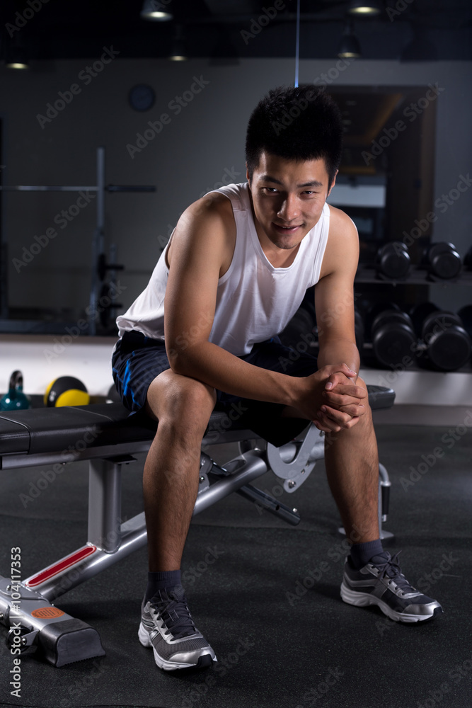 young man working out in modern gym