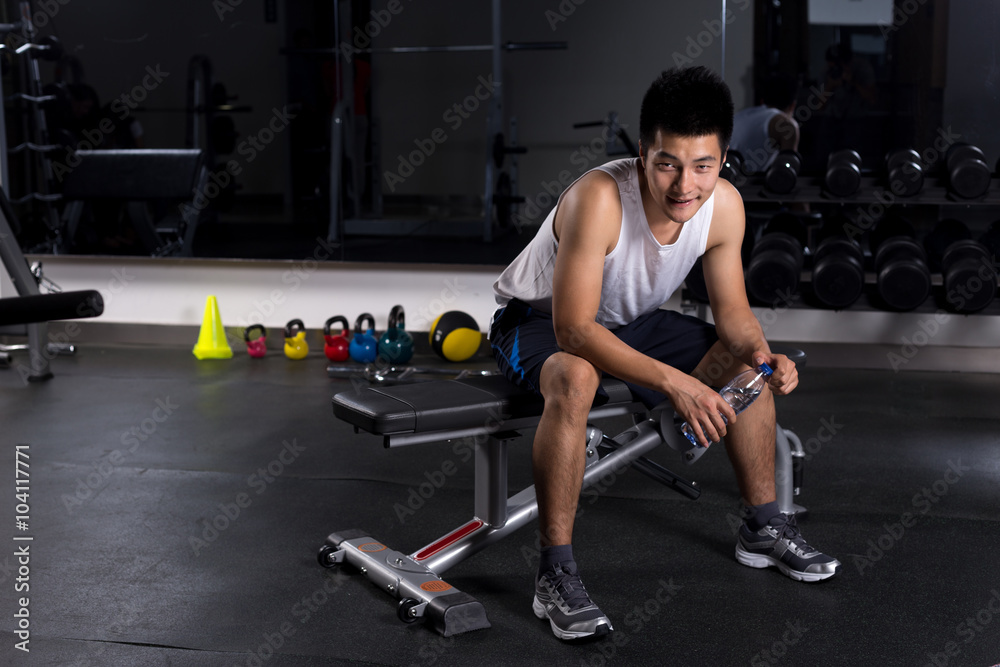 young man working out in modern gym