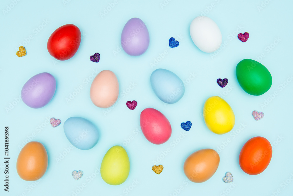 Colorful easter eggs on pastel background