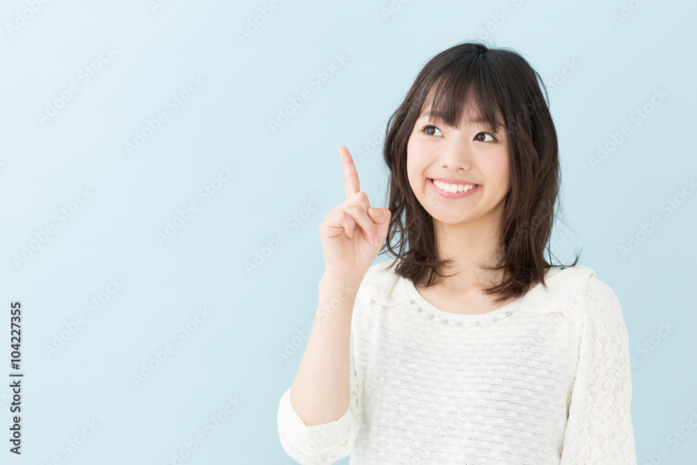 attractive asian woman on blue background