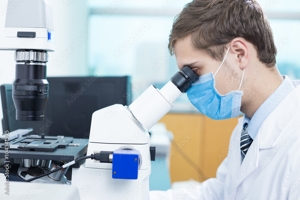 young man does medical experiment in lab