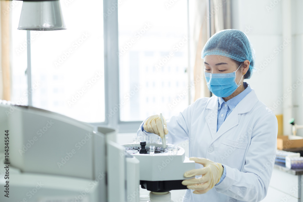 beautiful young girl does medical experiment in lab