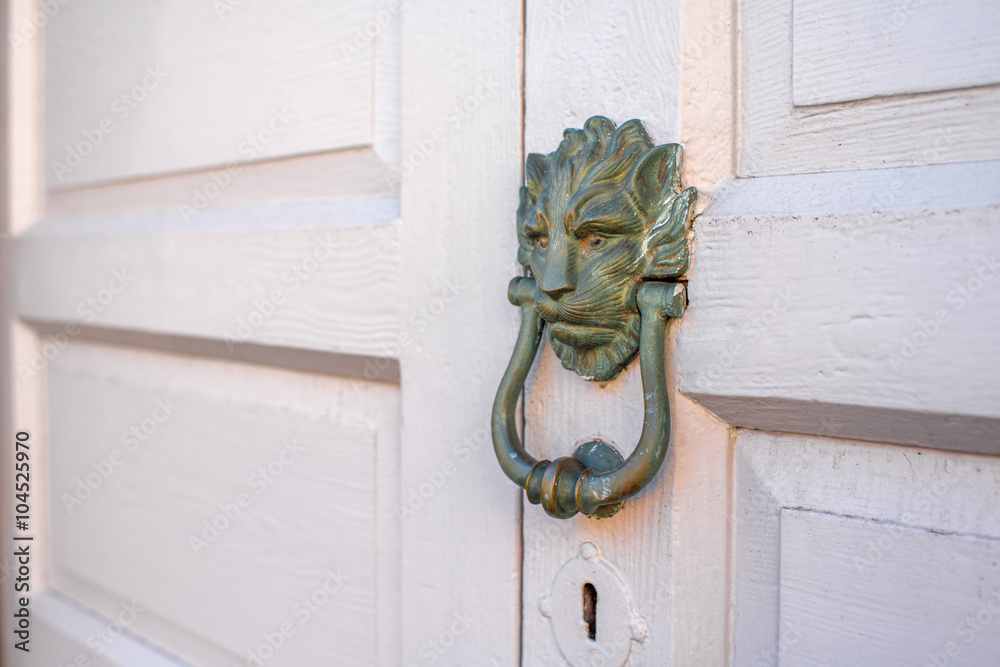 Old handle on the wooden door in Santa Cruz de la Palma city in Spain. Architectural detail close-up