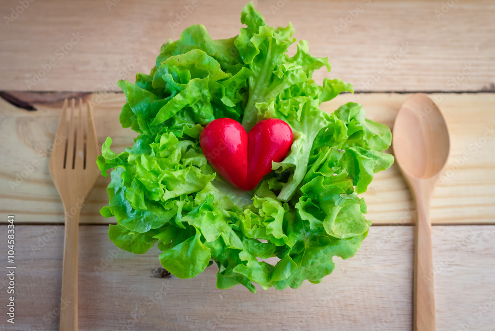 lettuce salad with red heart and wooden spoon.jpg