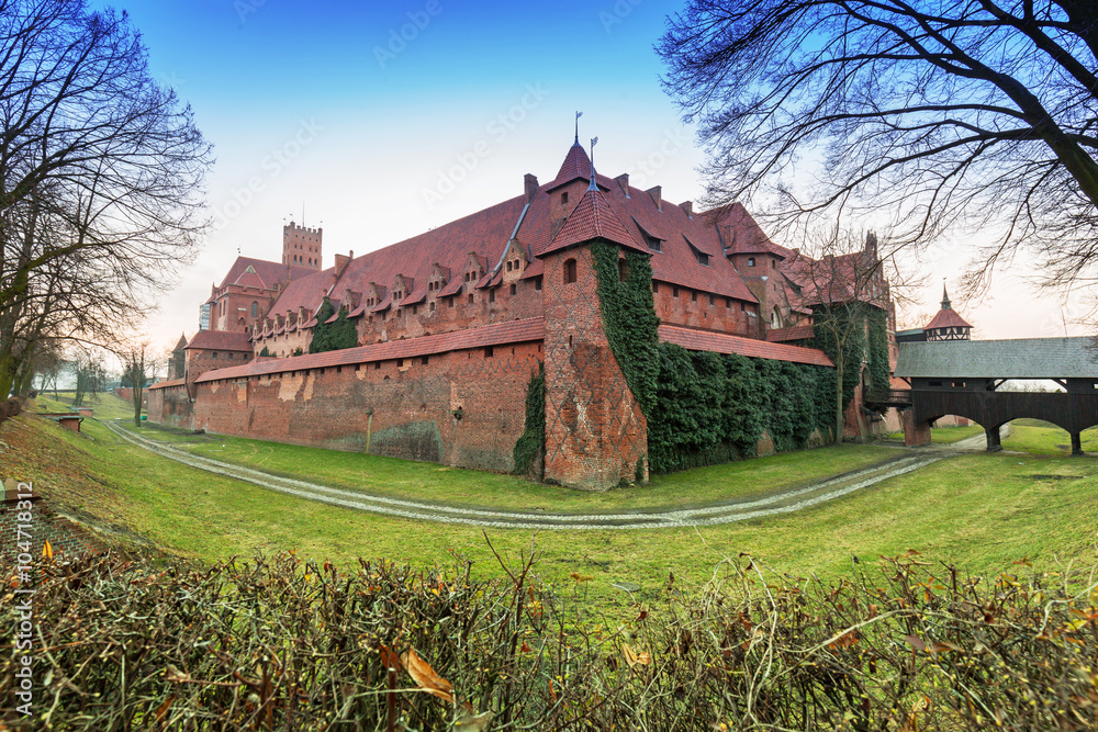 The Castle of the Teutonic Order in Malbork at sunset, Poland