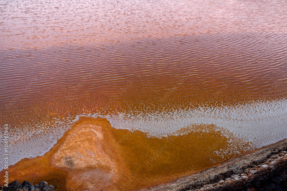 Close-up view on the ocean water on the salt pools on natural manufacturing on La Palma island in Sp