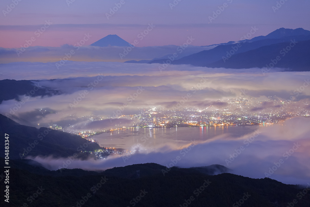 Beautiful Mountain Fuji and lake suwa at sunrise time in autumn season seen from Mt. Takabocci