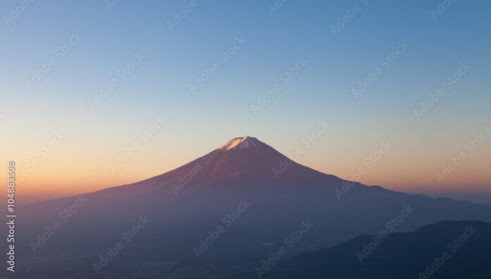 Top of mountain Fuji and sunrise sky in autumn season