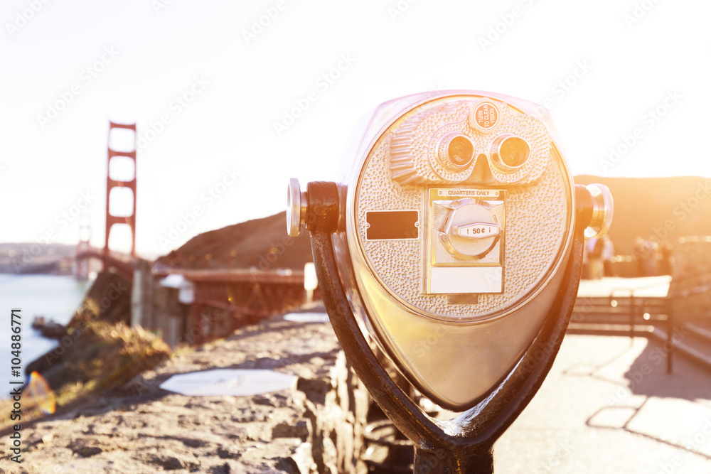 touristic telescope with gold gate bridge