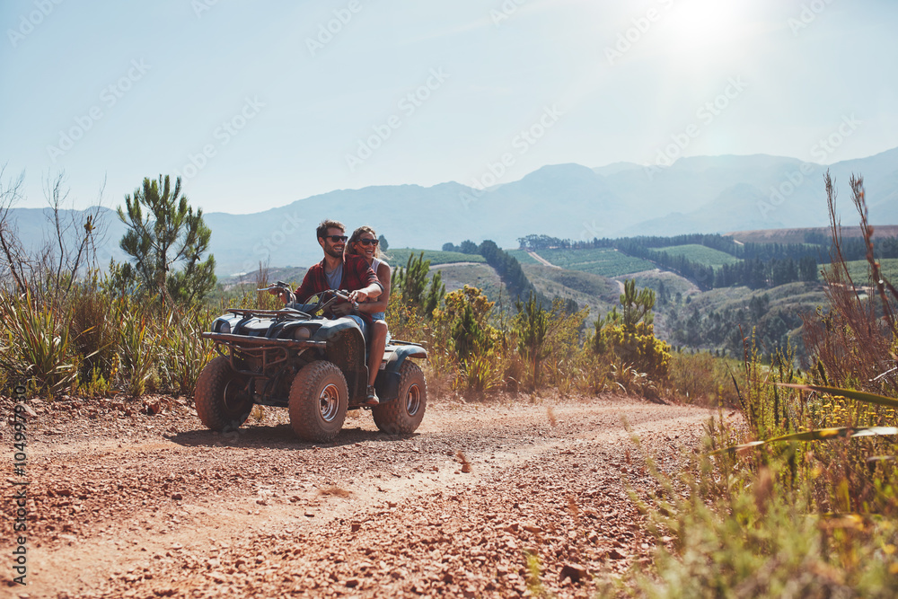 Couple on holiday enjoying on a ATV bike ride.