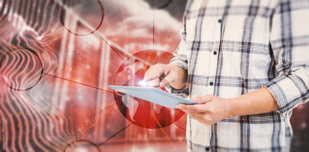 Composite image of mid section of man using tablet computer